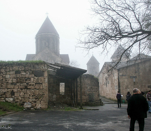 2006 armenia haghartsin architecture church family fog garden nature rock spire tree village wall tavush