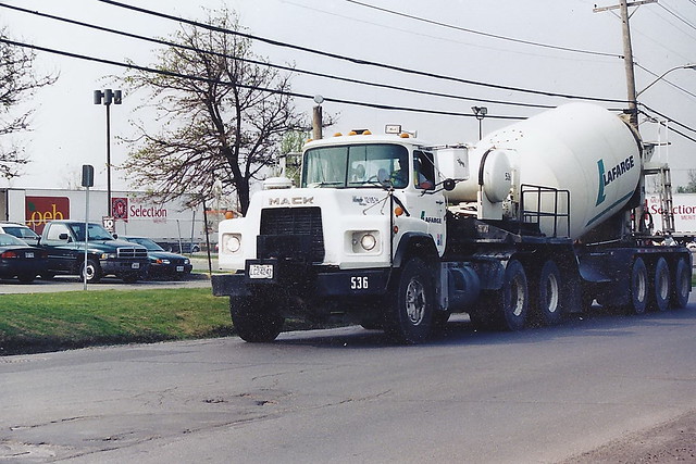 Lafarge 536 Mack R Series daycab truck with a tridem tri-axle cement