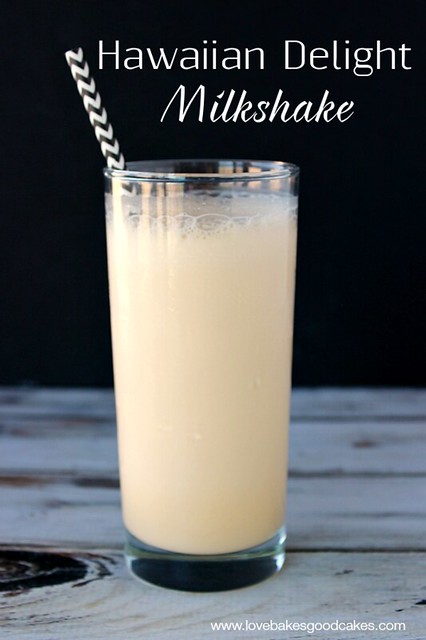 Hawaiian Delight Milkshake in a glass with a straw.