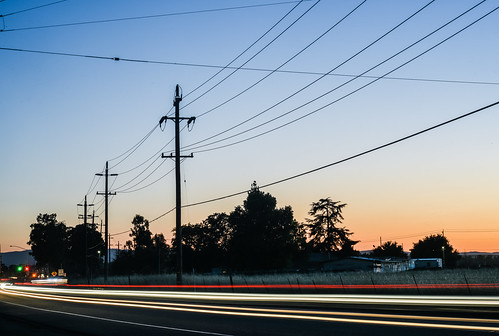 eastbay alamedacounty bayarea may 2017 spring boury pbo31 color nikon d810 country lightstream motion traffic highway 580 roadway livermore sunset blue powerlines orange silhouette