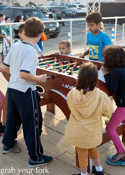 Kids playing fusball at The Beach Canteen during the Dubai Food Festival