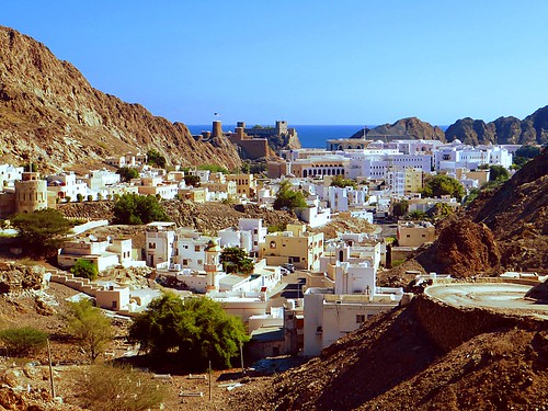 white palace muscat oman panorama sea mountain rock fort blue summer city water sky
