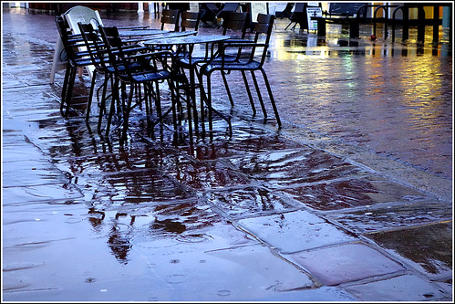 wet rain reflections chairs pavement tables chichester rx100