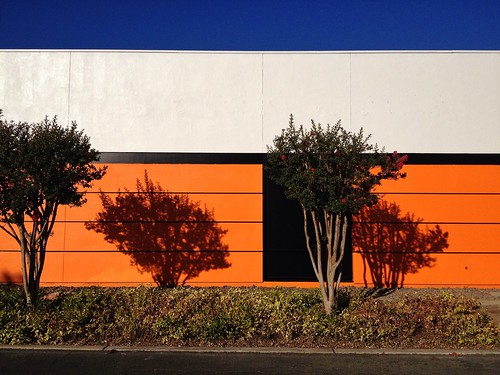 street city blue light shadow sky orange white abstract color building tree rooftop wall architecture mall golden bush bright landscaping stripe scenic business sidewalk roadside stockton slab fragment