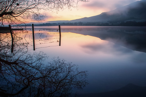 ullswater lake england uk sunrise fence reflection water hills landscape mist silhouette