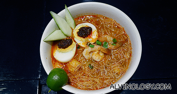 Nyonya Mee Siam (Nyonya Mee Siam Served dry with a touch of tamarind accompanied with prawns, egg sambal, beansprouts, beancurd and otah.)