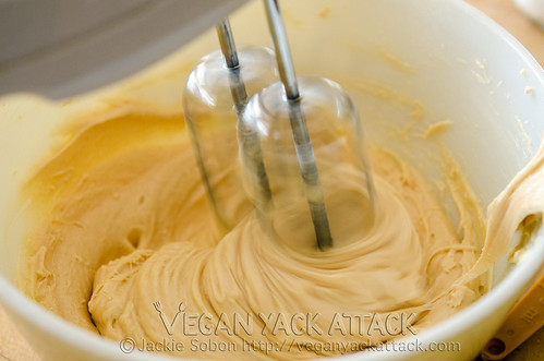 Beaters mixing vegan cream cheese peanut butter frosting