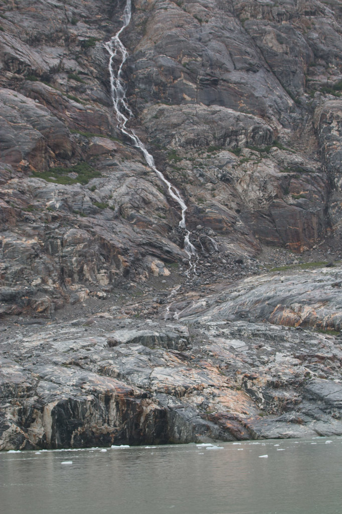 small waterfall near glacier