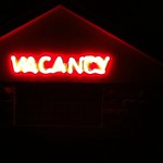 Neon Vacancy sign in the darkness.