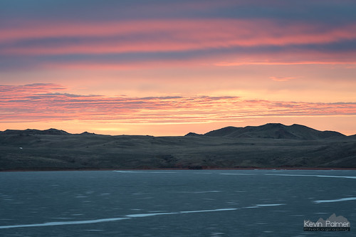 march spring nikond750 nikon180mmf28 telephoto lakedesmet sunrise early morning color colorful clouds sky orange pink red water frozen ice icy hills gold golden wyoming