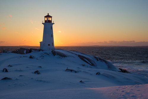 peggyscove novascotia ns canada sunset lighthouse winter snow cold ocean atlantic