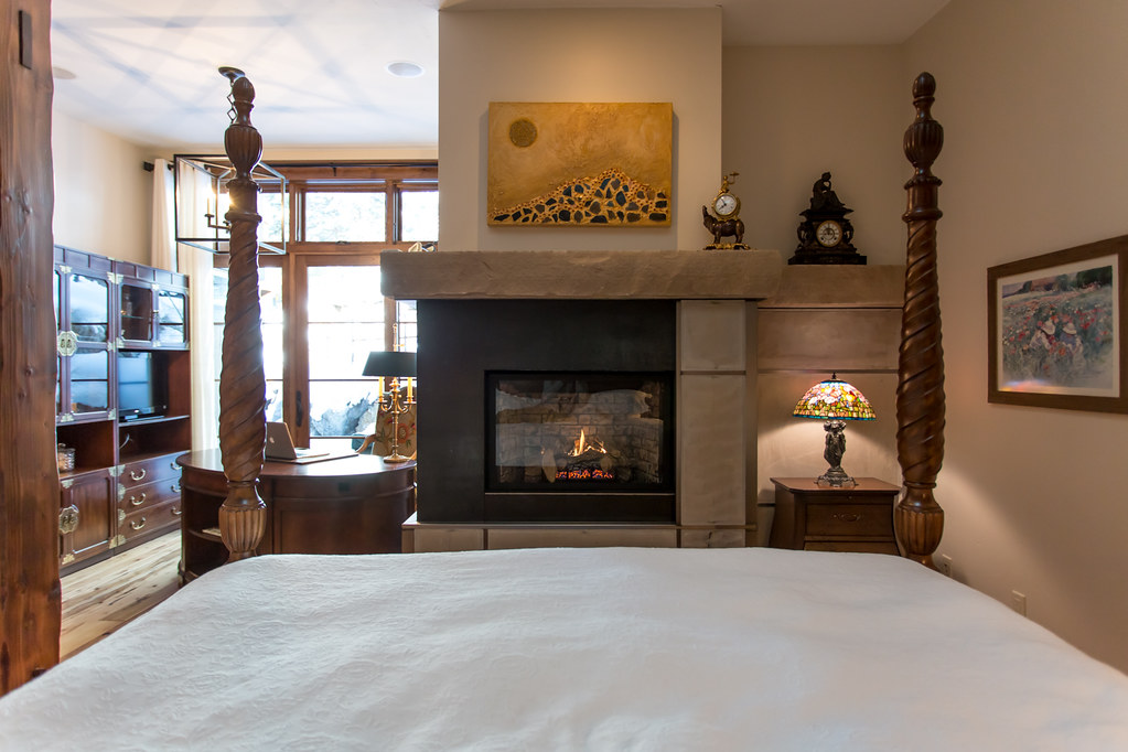 metal fireplace, gas fireplace in bedroom, buff sandstone rock, modern fireplace, 11 e. spruce street, steamboat home for sale