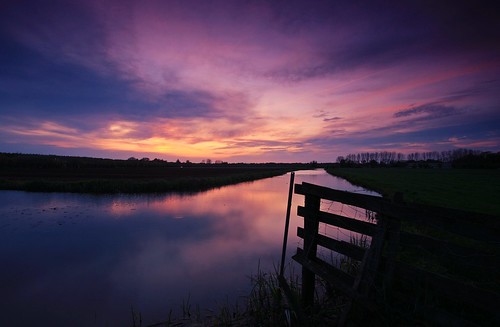 sunset water sky polder netherlands dusk fence