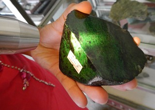 shining a light on a piece of jade to show its depth and quality