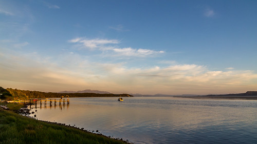 water westcoast boats jetty sunset twilight clouds strahan tasmania australia au