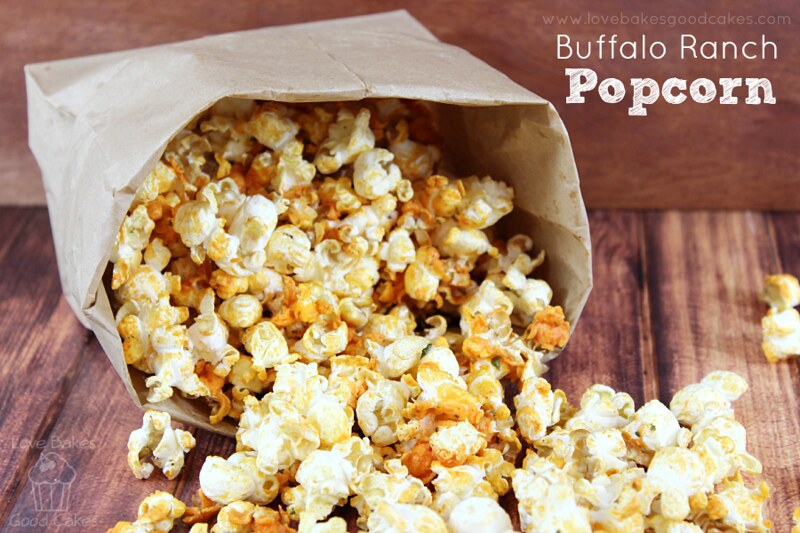 Buffalo Ranch Popcorn spilling out of a brown paper sack.
