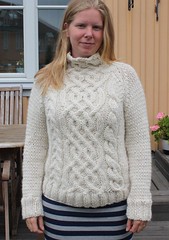 Blonde girl in cabled wool sweater