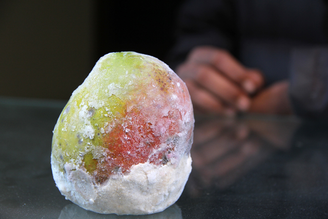 Frozen mango, solid as a rock
