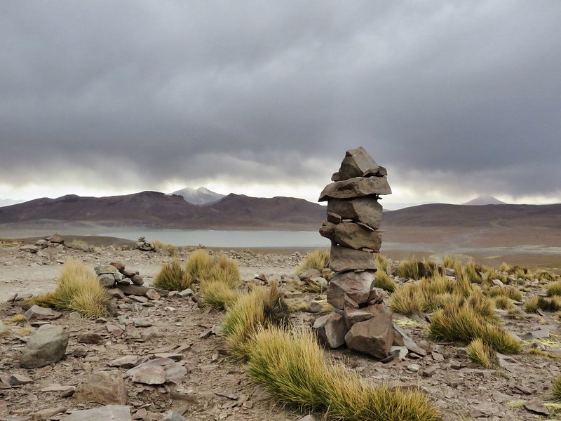A cairn above a lake in Uyuni, Bolivia