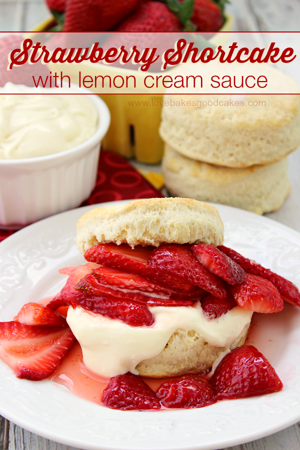 Strawberry Shortcake with Lemon Cream Sauce on a plate with biscuits and fresh strawberries.