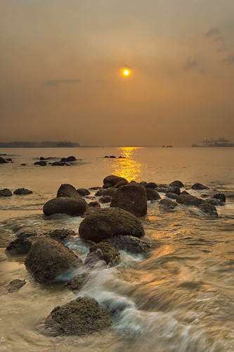ocean sunset sea sun seascape reflection texture water rock stone asian gold golden nikon singapore asia pattern dusk rocky wave punggol wavy punggolbeach d700 kozaw