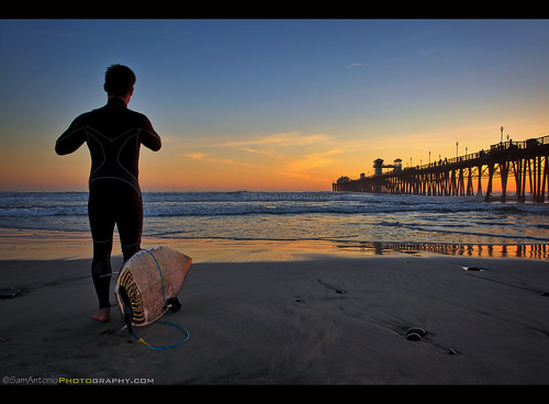 outdoor oceanside pier sandiego surf surfing surfer ocean california water pacific beach sunset vacation sea sand clouds summer blue sky surfboard wave shore beautiful sun travel orange nature landscape holiday sport coastline waves man recreation background silhouette marine lifestyle peaceful scenic tranquility landmark young seaside male colorful seascape samantoniophotography