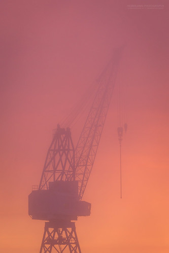 brygga fog kaldnes tønsberg canal crane harbor harbour industry mist orange seaside silhouette sunset vestfold norway no