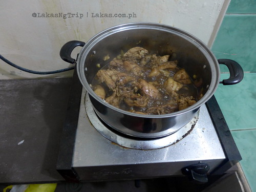 Cooking chicken adobo. DDD Habitat Inc. in Lorega, Kitaotao, Bukidnon
