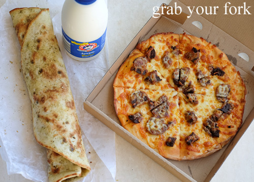 Saj with yoghurt, olive, tomato and mint; sojouk and long cheese pizza; and ayran yoghurt drink at Charlie's Pizza, Canterbury