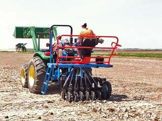 Picture of a planter in a test field planting rice