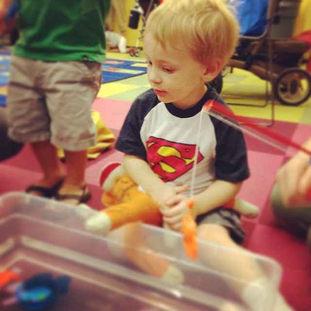 Waiting his turn at the fishing hole. Notice "baby" has #sharpie on him. #heismine #toddler #library
