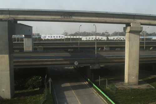 Depot track climbs above the freeway, before rejoining the main maglev line
