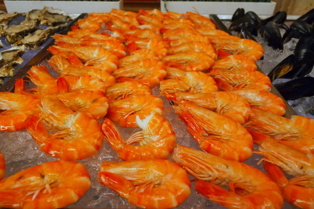 Fresh boiled prawns on ice at attention