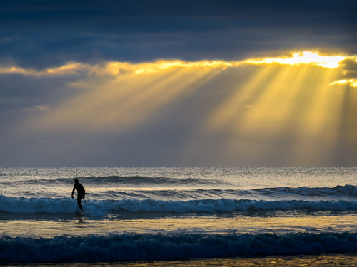 light sea newzealand sky water clouds sunrise dawn surfer tide rays hawkesbay haumoana
