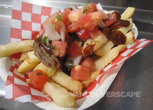 Feastro/Dirty Fries: Kennebec potatoes, pulled pork, BBQ sauce, onions, tomato, salsa, jalapeños, hold the lemon garlic aioli
