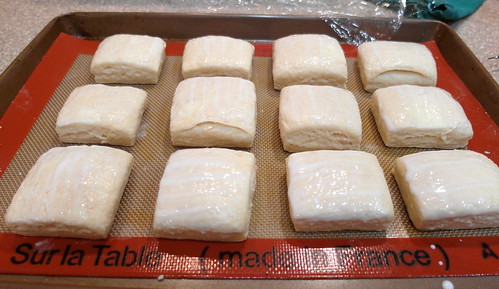 12 square biscuits on a baking tray