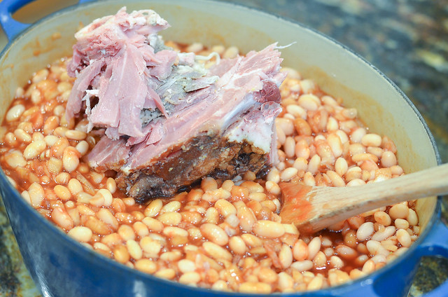 A meaty ham bone is added to the Dutch oven.