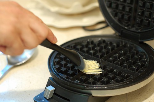 Using a silicon basting brush to grease the waffle iron by Eve Fox, the Garden of Eating copyright 2014