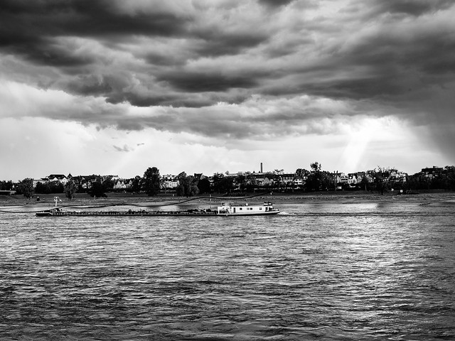 A-boat-on-the-Rhine-as-a-storm-approaches