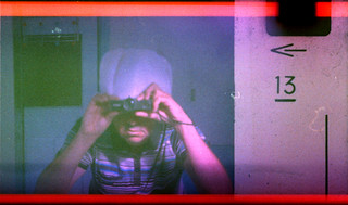 reflected self-portrait with Keystone Zoom 66 camera and white hat