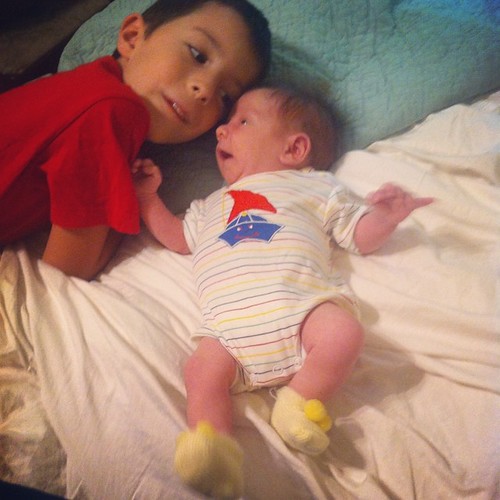 Best buddies. Joshua is sporting Stephan's old baby clothes. Too cute!