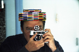 reflected self-portrait with FED-4 camera and ersatz lego hat