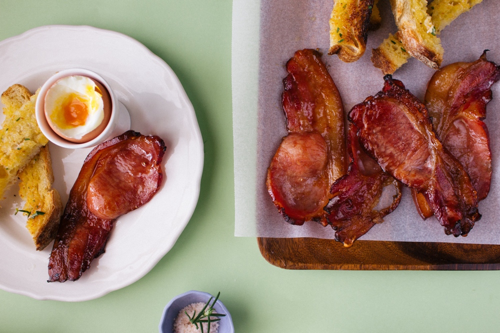 Soft-boiled eggs with herbed soldiers and espresso glazed bacon