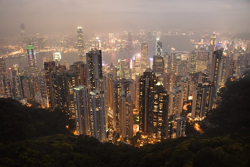 hongkong asia eastasia skyline cityscape urban city skyscrapers victoriapeak night smog drizzle wind handheld china prc aerial lowaerial skyterrace428 victoriaharbour vignette trees mountain icc nikon travel wideangle