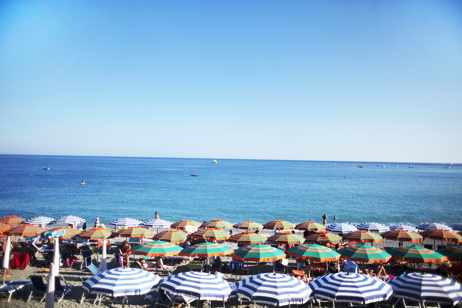 Beach umbrellas in Monterosso, Cinque Terre, Italy