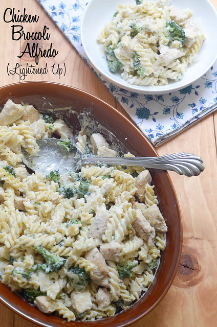 Chicken Broccoli Alfredo in a baking dish with a spoon.