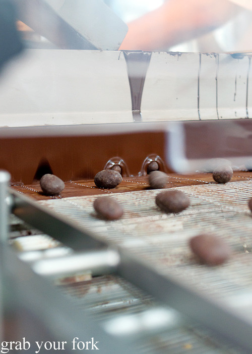 Dates being enrobed in chocolate at Bateel Date Factory, Dubai