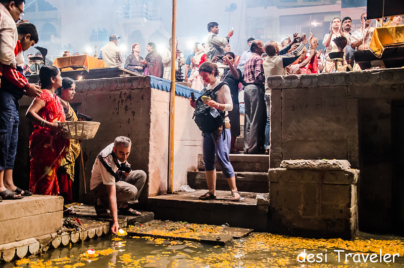 foreigners floating lamps in ganges at Evening Ganga Aarti Dashashwamedh Ghat Varanasi