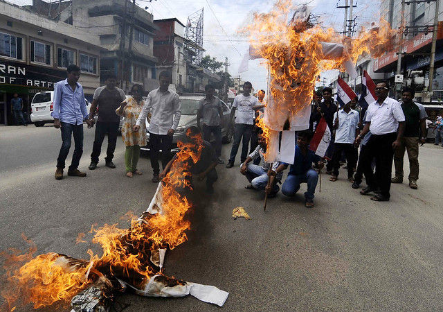 AGP activists burn the effigy of union coal and power minister Piyush Goyal and Assam chief minister Tarun Gogoi as a protest against price hike and central decision to resume the construction of Lower Subansiri Hydroelectric Power project, in Guwahati...