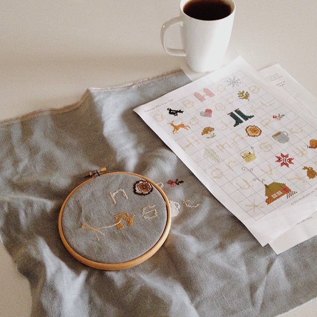 Rainy day progress, with necessary cup of tea. #happysunday #embroidery #aliciapaulson #winterwoodsabc